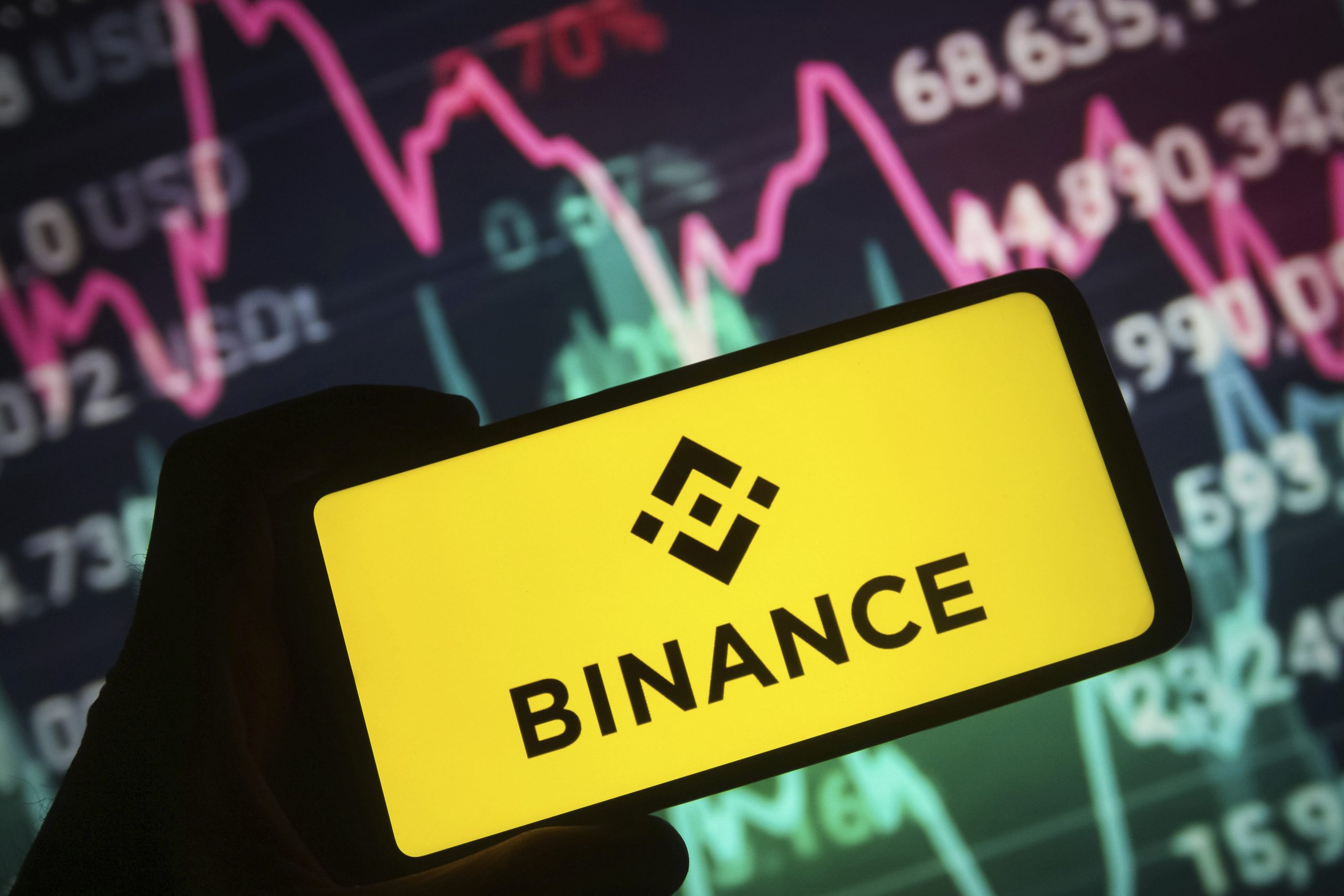 In this photo illustration, a Binance logo of a cryptocurrency exchange is seen on a smartphone screen.