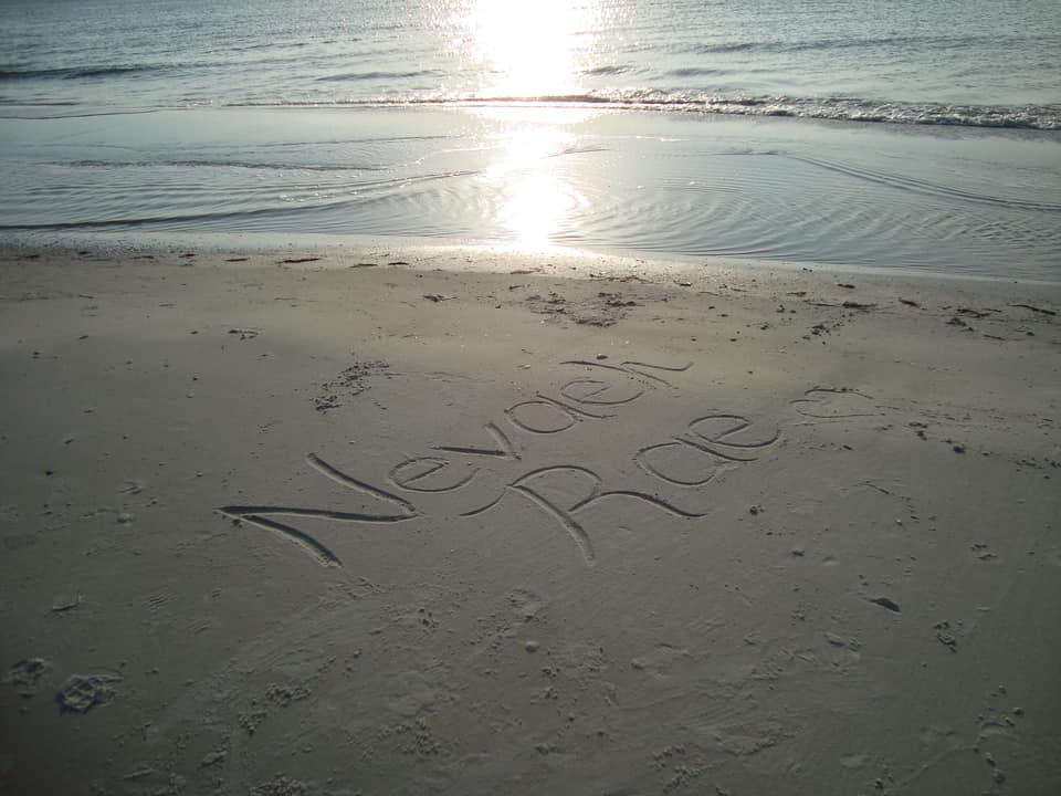 Navaeh Rae's Name written in the sand by family.  Photo Courtesy of Wallace Family/Facebook.com