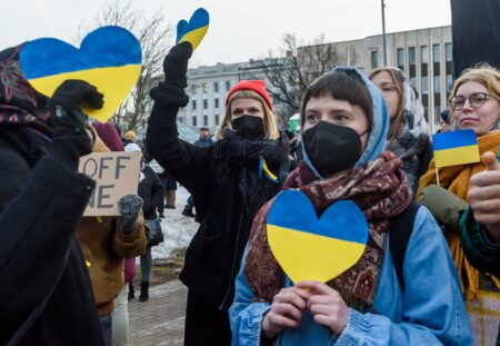 RIGA, LATVIA. 24th February 2022. Selective focus photo. People protest against Russian attack on Ukraine near Embassy of Russia in Latvia.