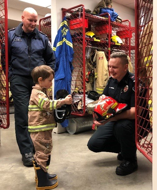 Oliver Lipinski Getting Ready to Ride on the Firetruck and a Become Junior Fireman. Photo Courtesy of Parksville Fire Department/ Facebook