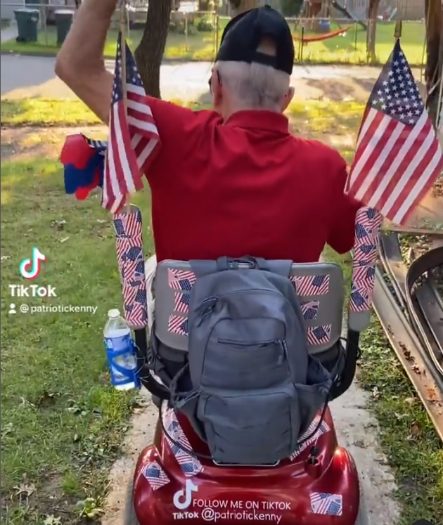 Patriotic Kenny showing off his new scooter