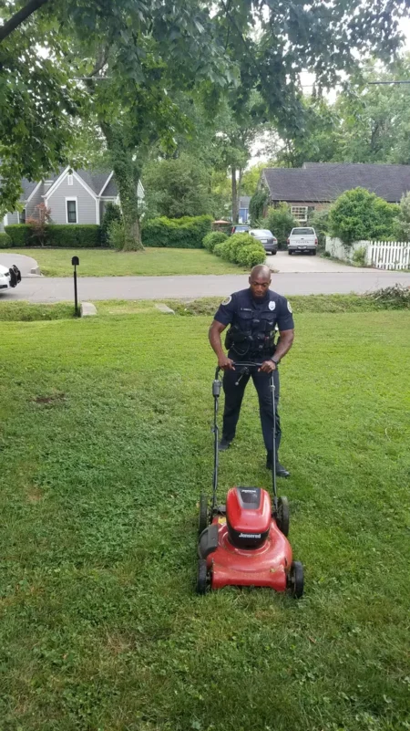 Nashville Officer cutting the grass